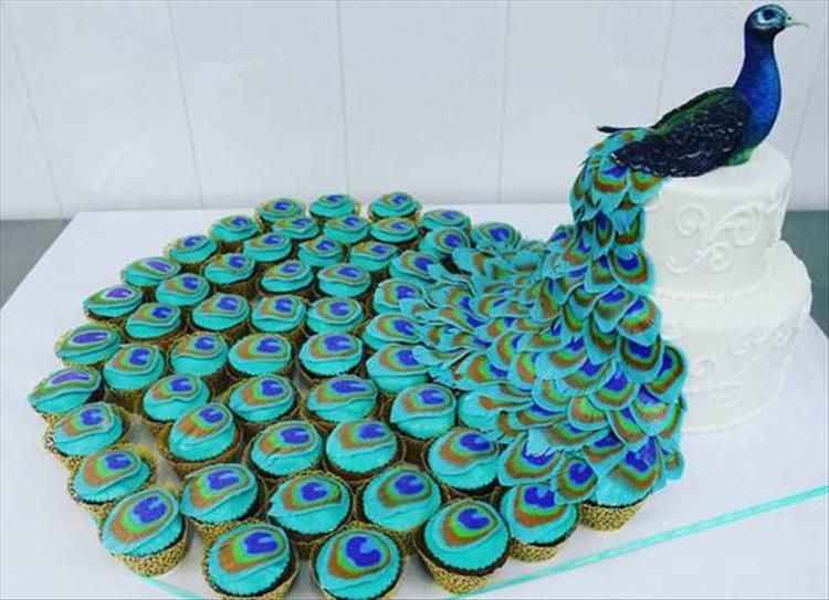 Peacock Wedding Cake - Creative three-layer peacock cake uses cupcakes for the tail of the bird