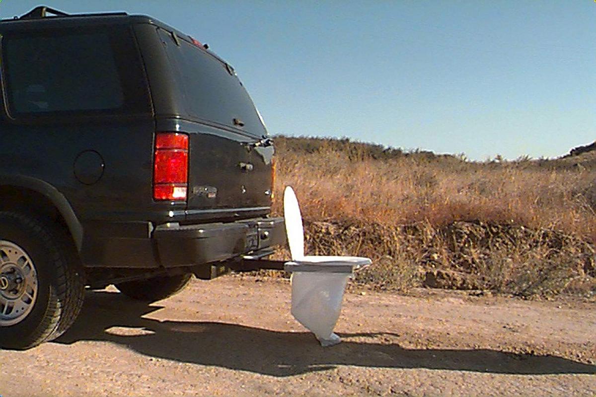 Bumper Dumper - Portable Toilet Seat attaches to truck hitch