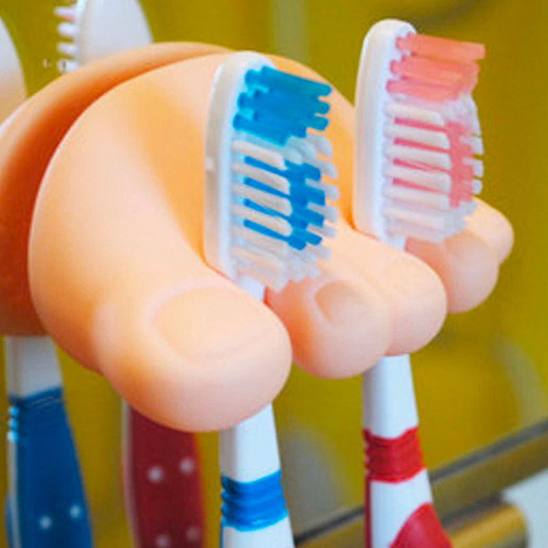 Toes and foot shaped toothbrush holder