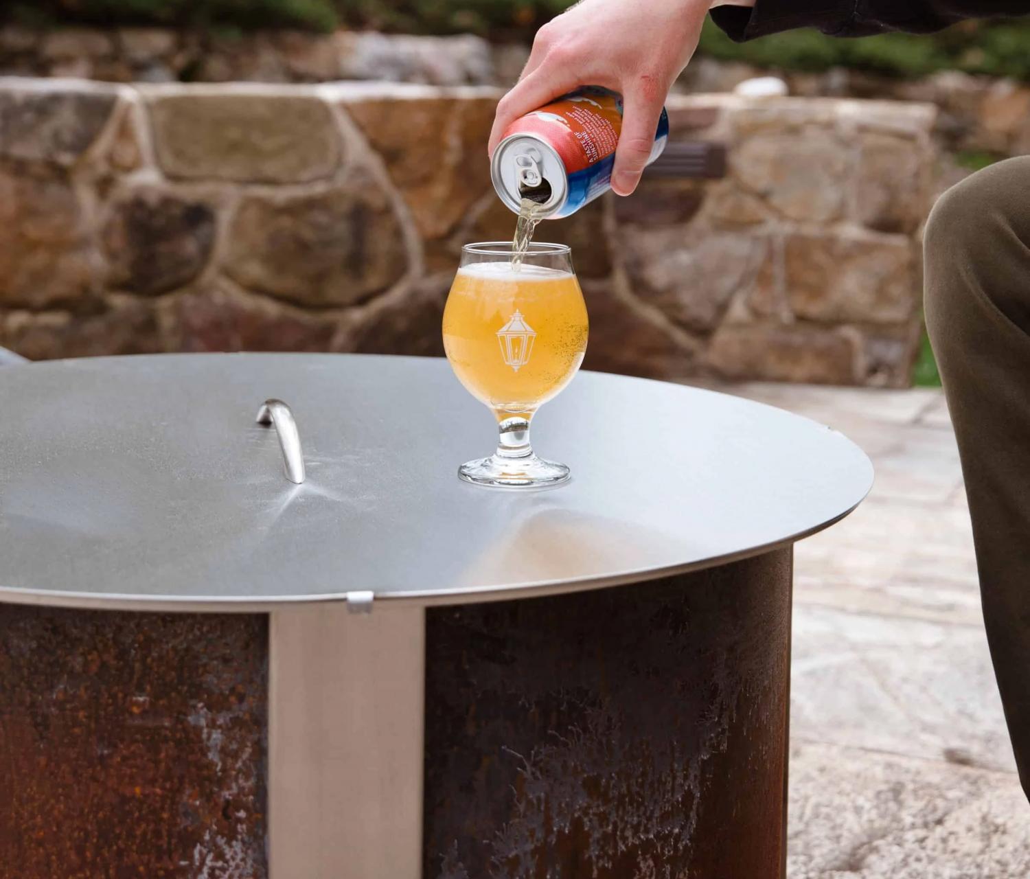 Ultimate Campfire Grill Turns Your Fire Pit Into a Tiered Cooking Machine - Breeo Fire pit cooker with winch