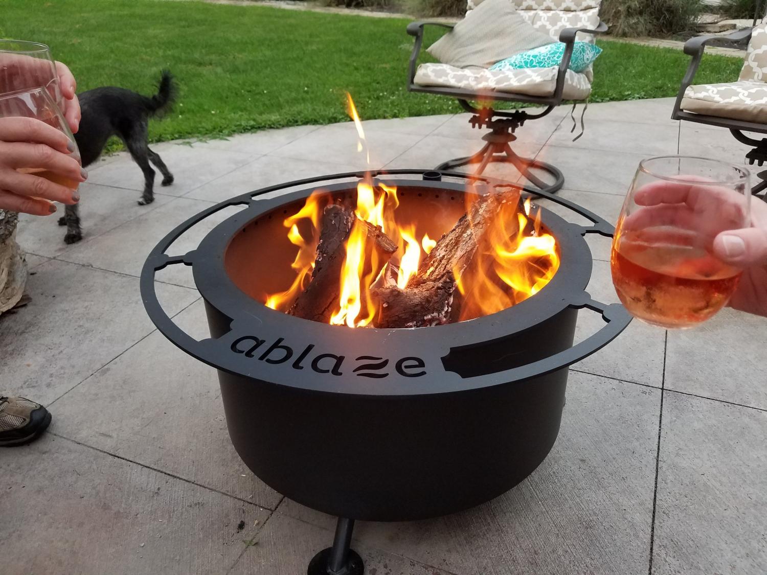  Ultimate Campfire Grill Turns Your Fire Pit Into a Tiered Cooking Machine - Breeo Fire pit cooker with winch