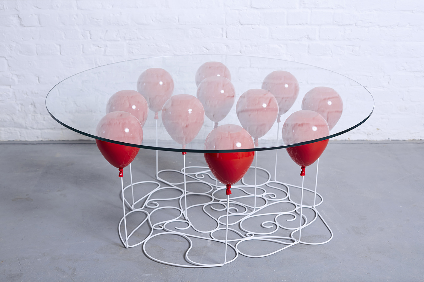 Up Balloon Table - Artsy table using balloons to hold up glass tabletop - Duffy London