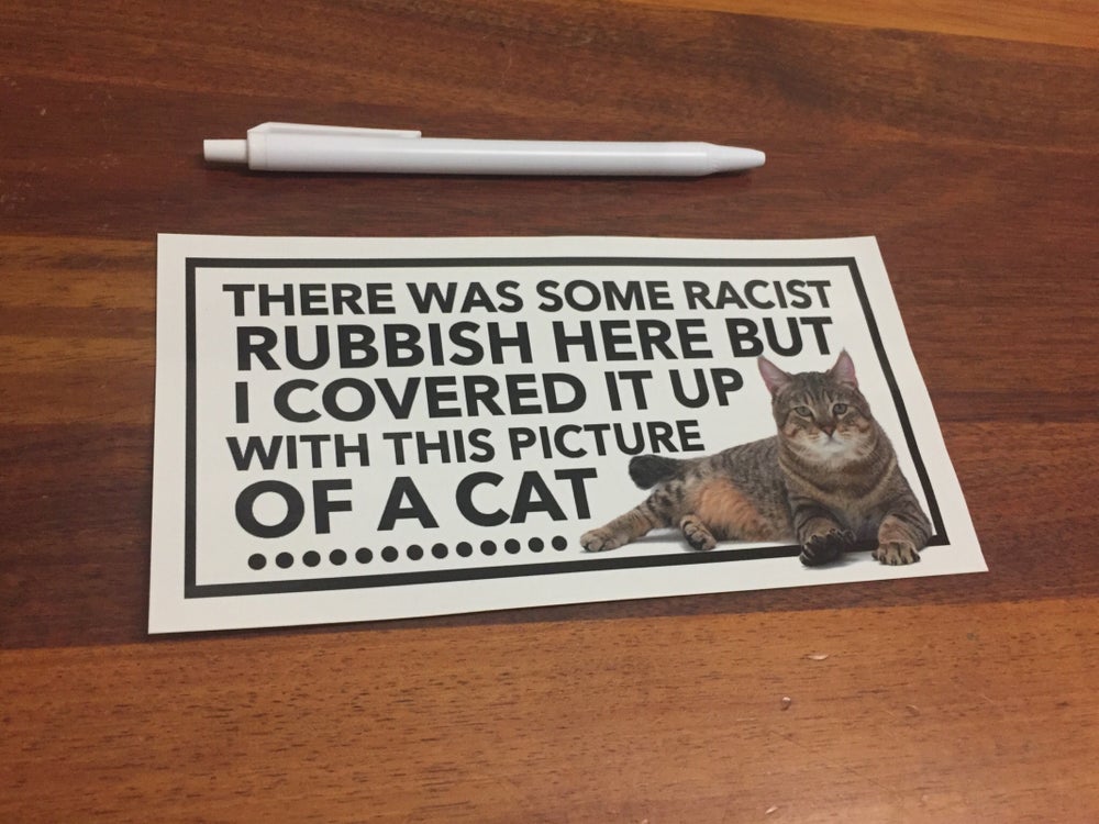 Giant Cat Sticker To Cover Up Racist Graffiti On The Streets - Manchester cat stickers