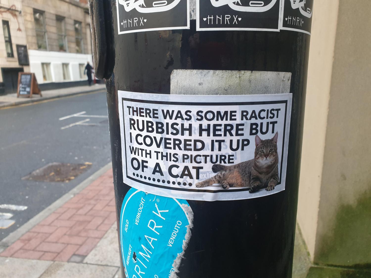 Giant Cat Sticker To Cover Up Racist Graffiti On The Streets - Manchester cat stickers